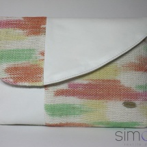 Woven hand dyed clutch bag with white leather