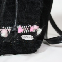 Pink and black pouch bag detail