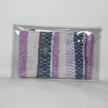 Pink and denim woven and plastic clutch