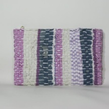 Pink and denim woven and plastic clutch back