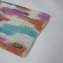 Rainbow woven and plasitc clutch detail