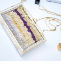 Gold and purple transparent and woven clutch