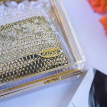 Gold and black transparent and woven clutch detail