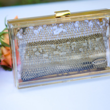 Gold and black transparent and woven clutch