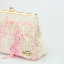 Pink and beige woven clutch