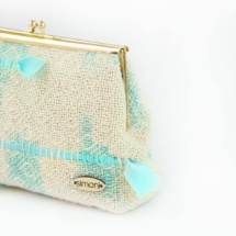 Tirquoise and beige woven clutch