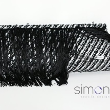Black and white woven clutch with fringe