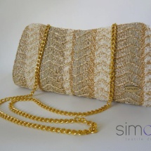 Gold woven clutch with chain