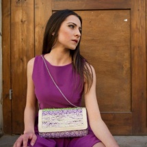 Green white and purple woven clutch