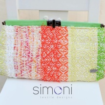 Orange green and white woven clutch with clip