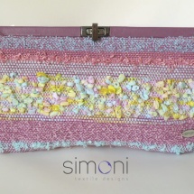 Pink woven clutch