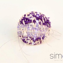 Purple and white woven ring