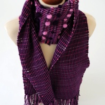 Purple scarf with pom poms