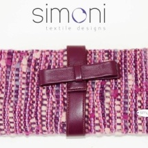 Purple woven clutch with bow