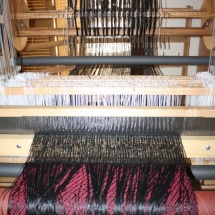 Weaving a fringed fabric