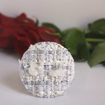 White and silver brooch