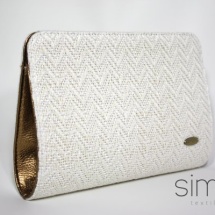 White clutch with gold leather