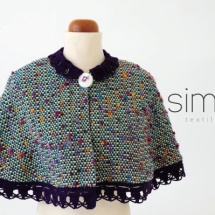 Woven cape with crochet lace