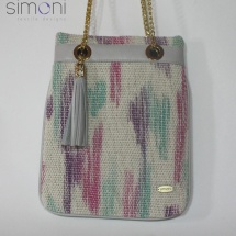 Woven hand dyed shoulder bag with tussle