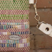 Woven, handmade purse with leather handle details