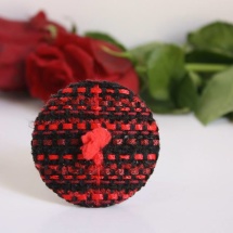 Woven red and black brooch