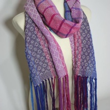 Woven shawl with patterns and stripes