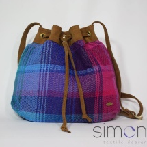 Woven shoulder bag with tan leather