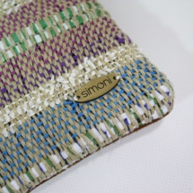 Hand-woven stripped purse with suede leathe