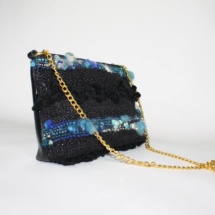 Black and blue purse with chain side