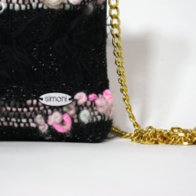 Pink and black purse with chain detail