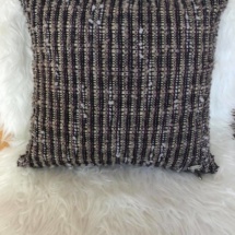 woven cushion with stripes