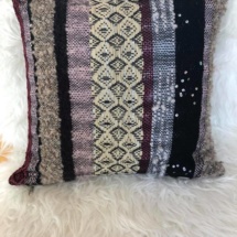 woven cushion with patterns